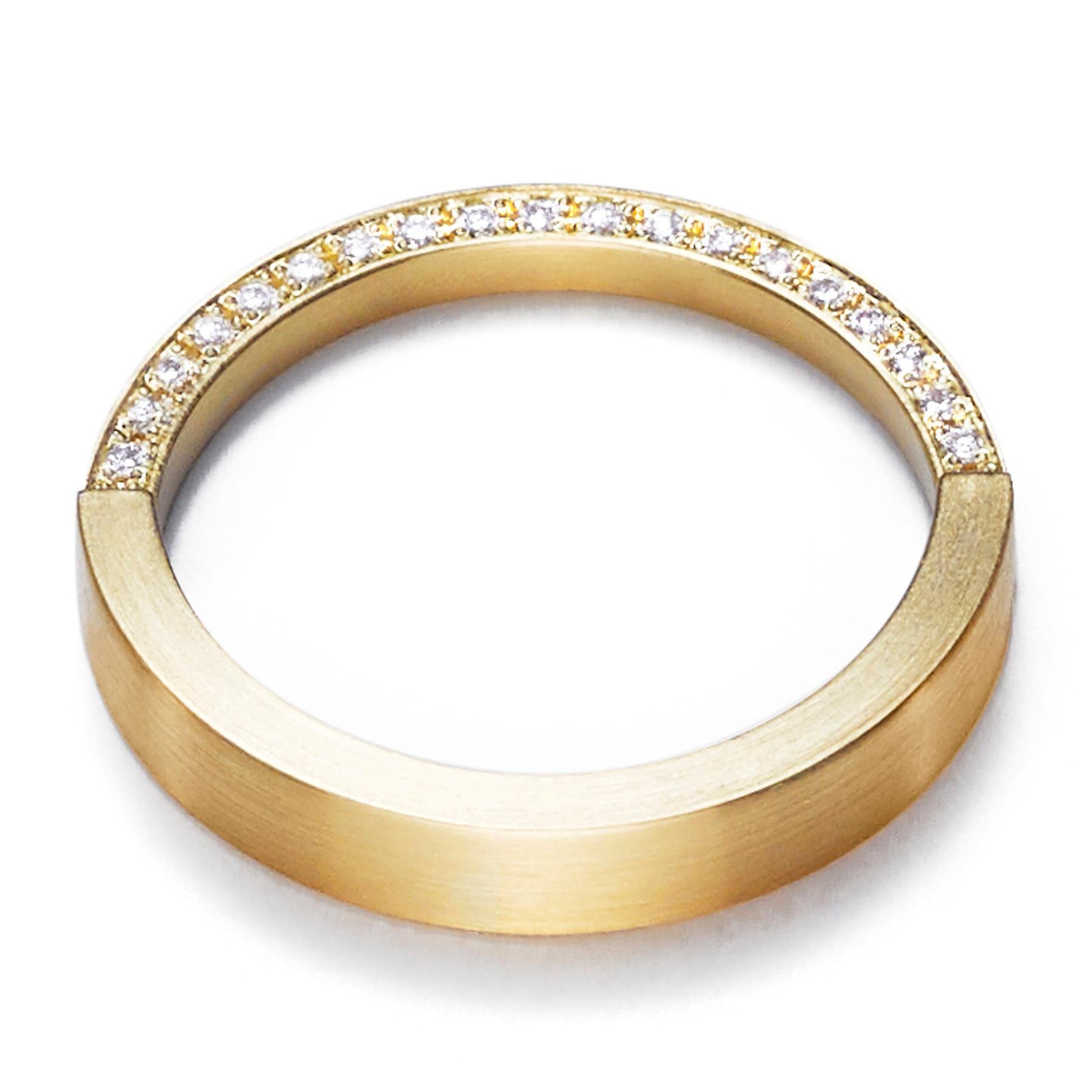 The 'Assemble03' ring has a square edge band with half the band narrowed in half and filled with diamonds. 
 Ideal for stacking* with other rings from the 'Assemble' range.

Diamond: 1mm (amount varies depending on ring size)
Band width: 3.6mm,