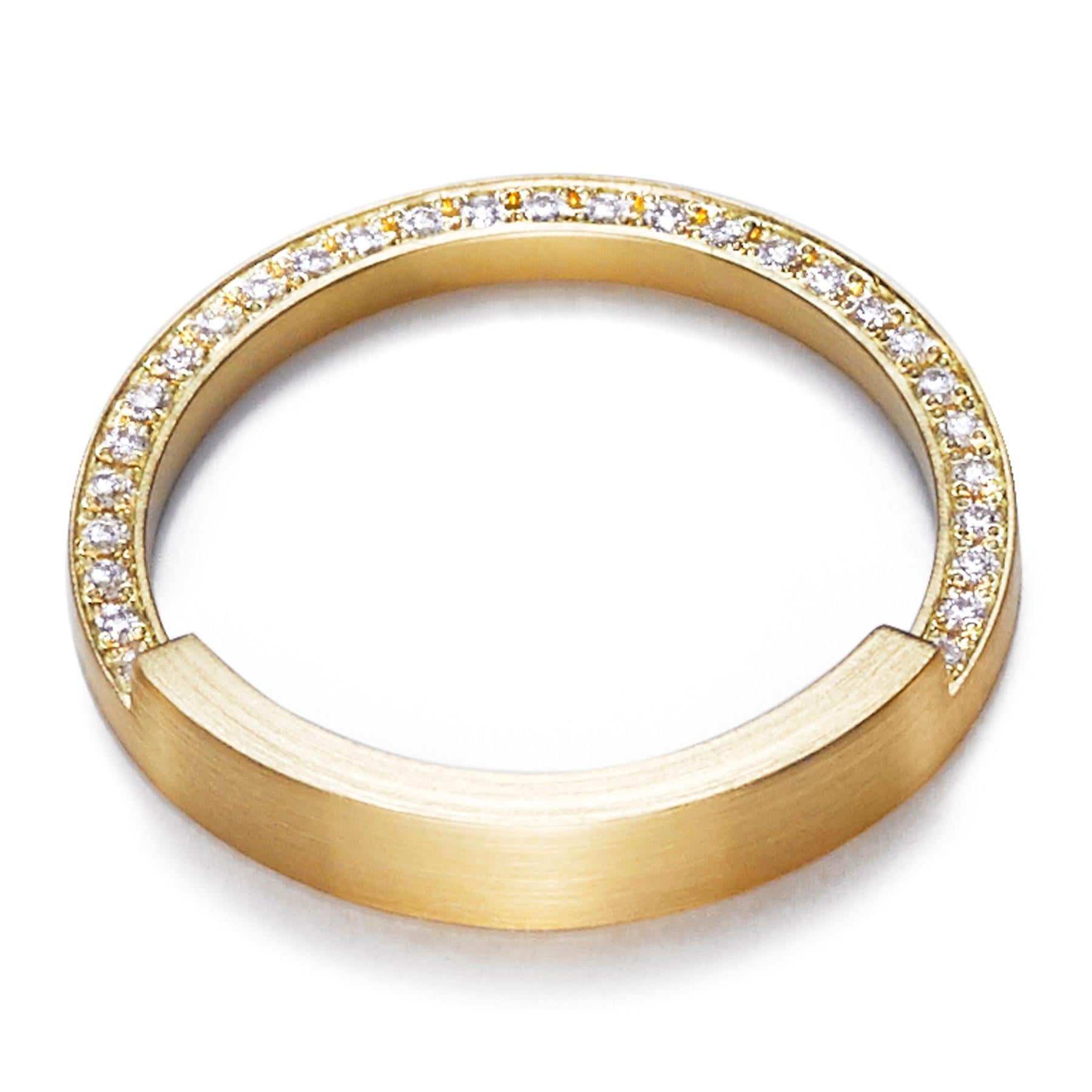 The 'Assemble 04' ring has a square edge band with two thirds of the band narrowed in half and filled with diamonds. Ideal for stacking* with other rings from the 'Assemble' range.

Diamond: 1mm (amount varies depending on ring size)
Band width: