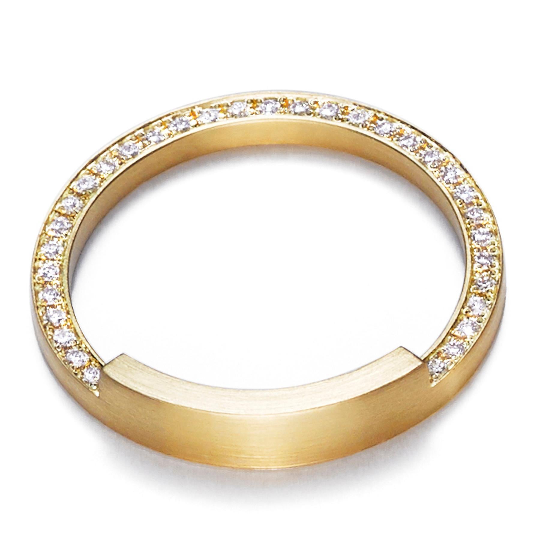 The 'Assemble 05' ring has a square edge band with three quarters of the band narrowed in half and filled with diamonds. Ideal for stacking* with other rings from the 'Assemble' range.

Diamond: 1mm (amount varies depending on ring size)
Band width: