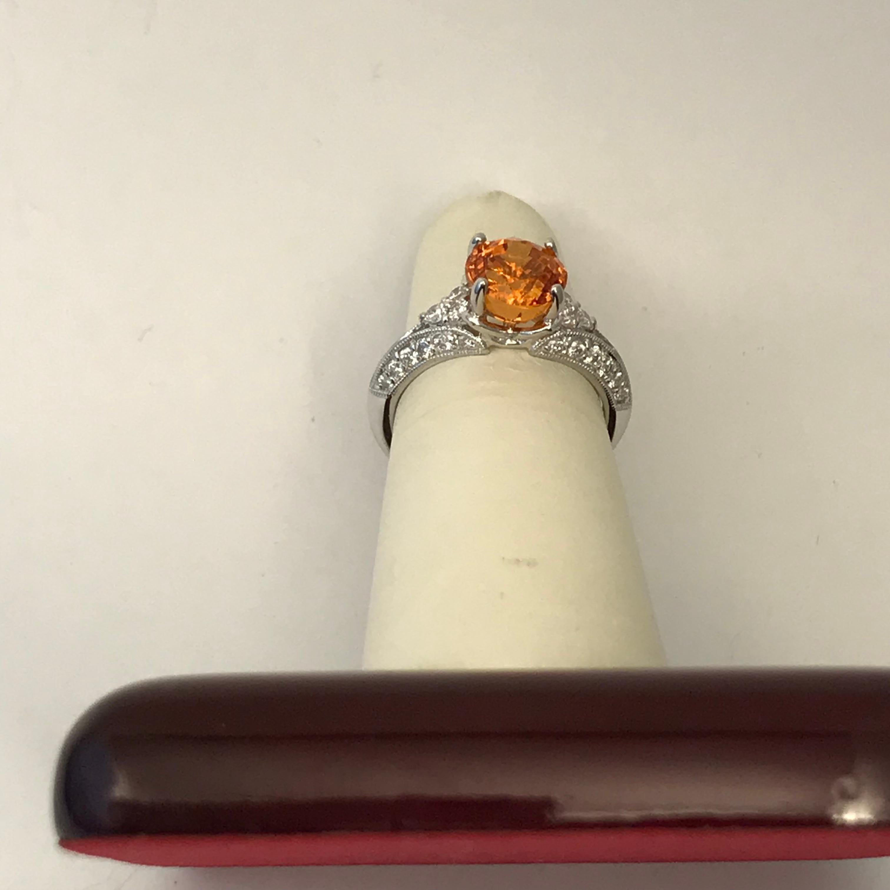 3.31 Carat Orange Spessartite Garnet Ring Set in Platinum 
Orange Spessartite Garnet 3.31 ct. platinum and diamonds .53 ct. 5.6 grams of gold

Ring will be sized free of charge after purchase just specify  ring size when ordering.

