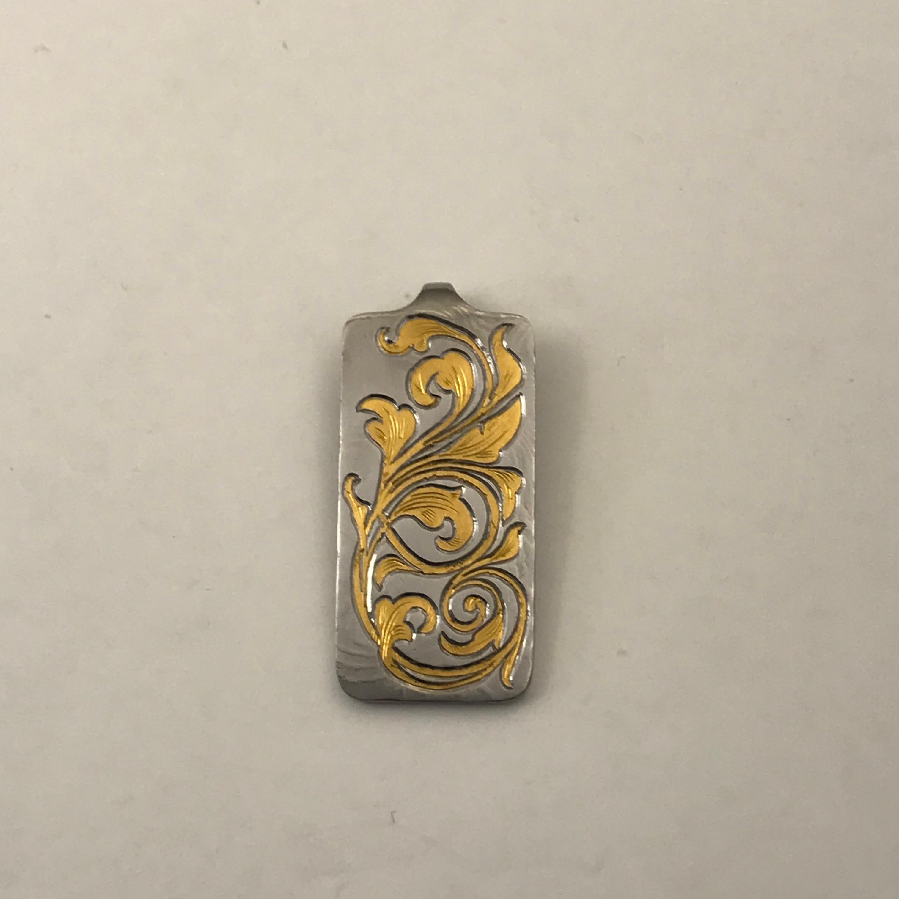 Damascus Steel & 24K Gold Pendant
This is a beautiful pendant made of Damascus Steel with 24 karat gold inlays. This is difficult to do because I have to cut out the pattern into the steel then hammer a sheet of 24k gold into the shape then engrave