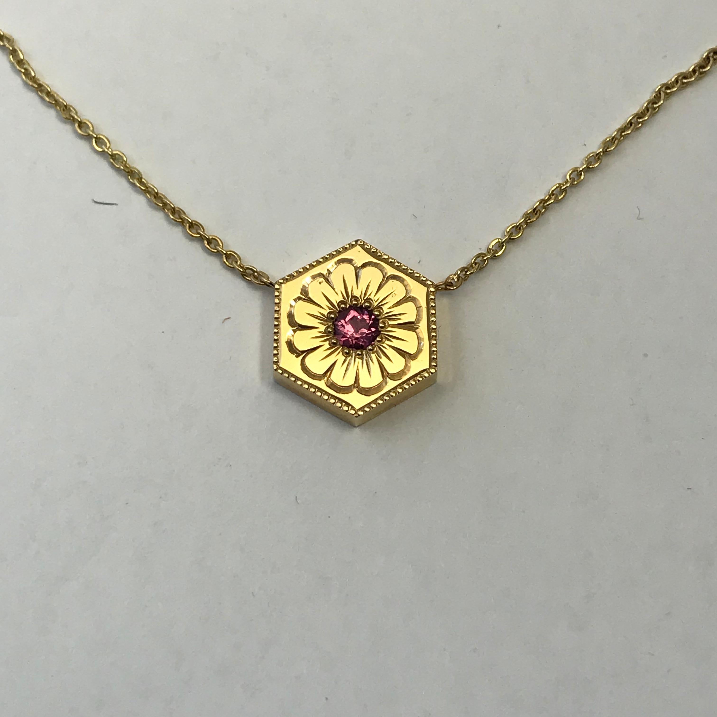 Hexagon Necklace in 14K Gold & Gems-Sapphire

This is a one of a series of unique necklaces. Each one is hand engraved in different styles and different gemstones. 

This beautiful pendant is in the very trendy hexagon style and is set with gems and