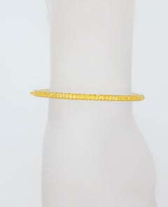 Bracelet jonc pavé de saphirs jaunes en or jaune 18 carats