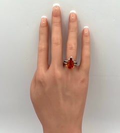Mandarin Garnet Pear and White Diamond Round Diamond Ring in Platinum