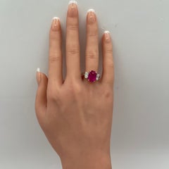 GIA 7 Carat Burma Pink Oval Sapphire and White Oval Diamond Ring in Platinum