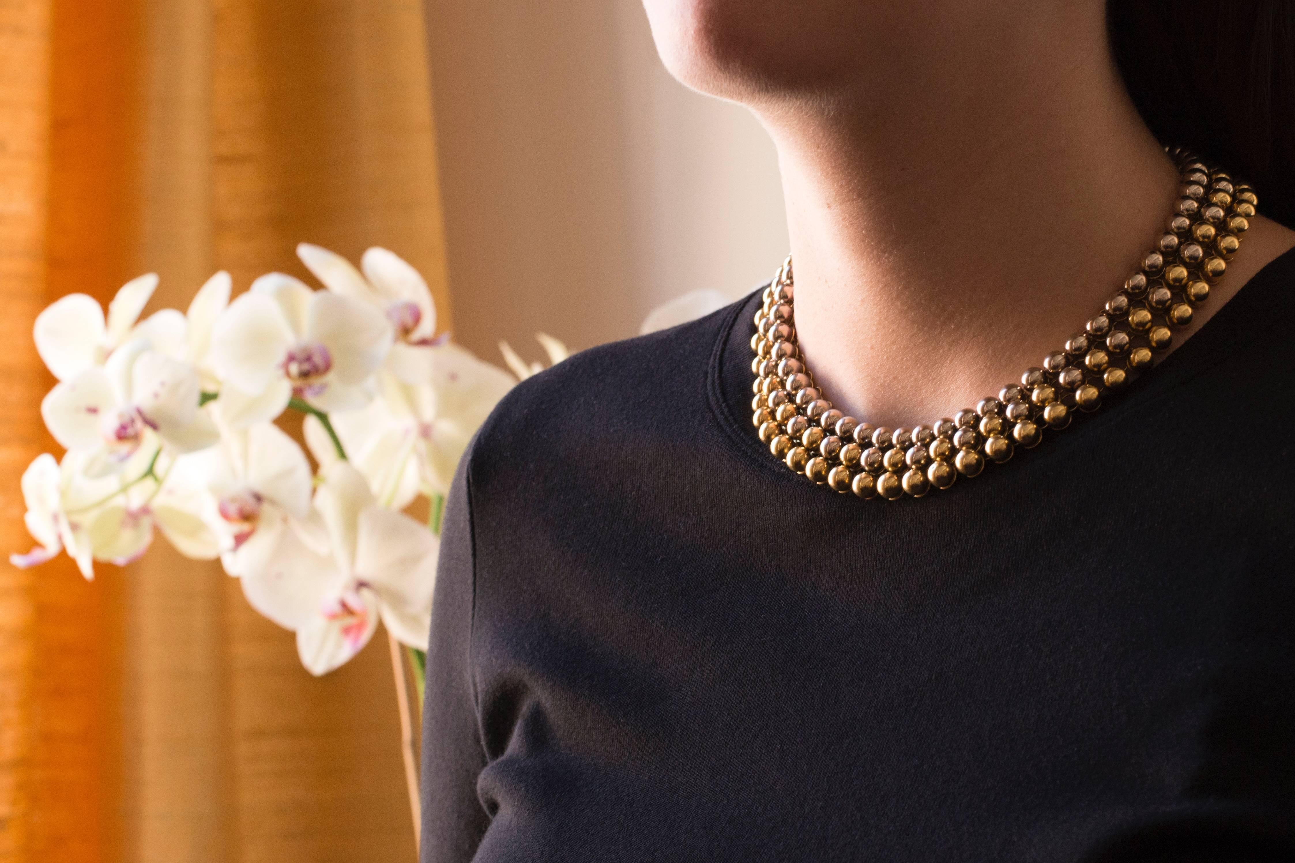 An 18 karat white and yellow gold bead collar, by the House Valentino, 1970s. This necklace measures 14.5