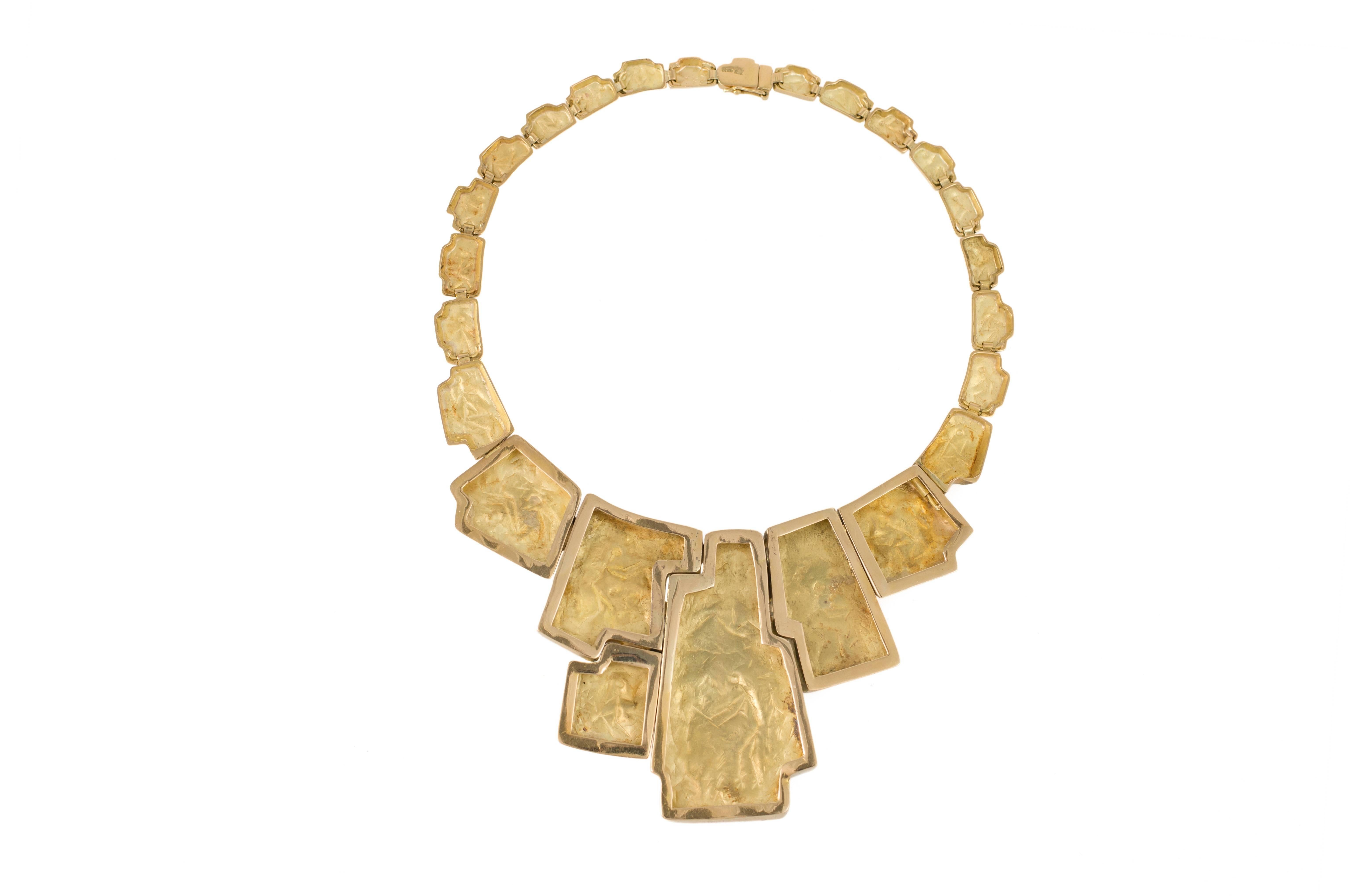 A vintage, 18 karat yellow gold necklace with geometric links of Inca inspired design with chased abstract figures, by Vasco (Varese and Scotto), Peru, circa 1965. It is 17 inches around. 

Joyeria Vasco was founded in 1953 by Italian immigrants to