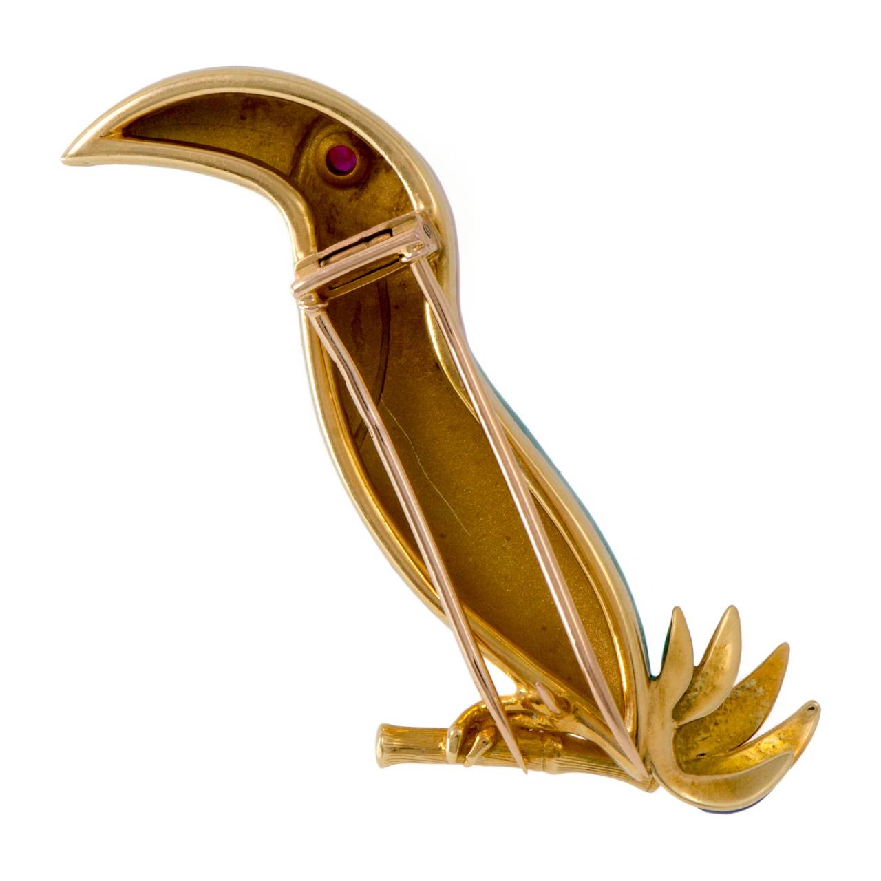 A favorite among bird loving brooch collectors, this finely enameled Bulgari toucan is perched on an 18k gold twig and has a sparkling red stone eye.