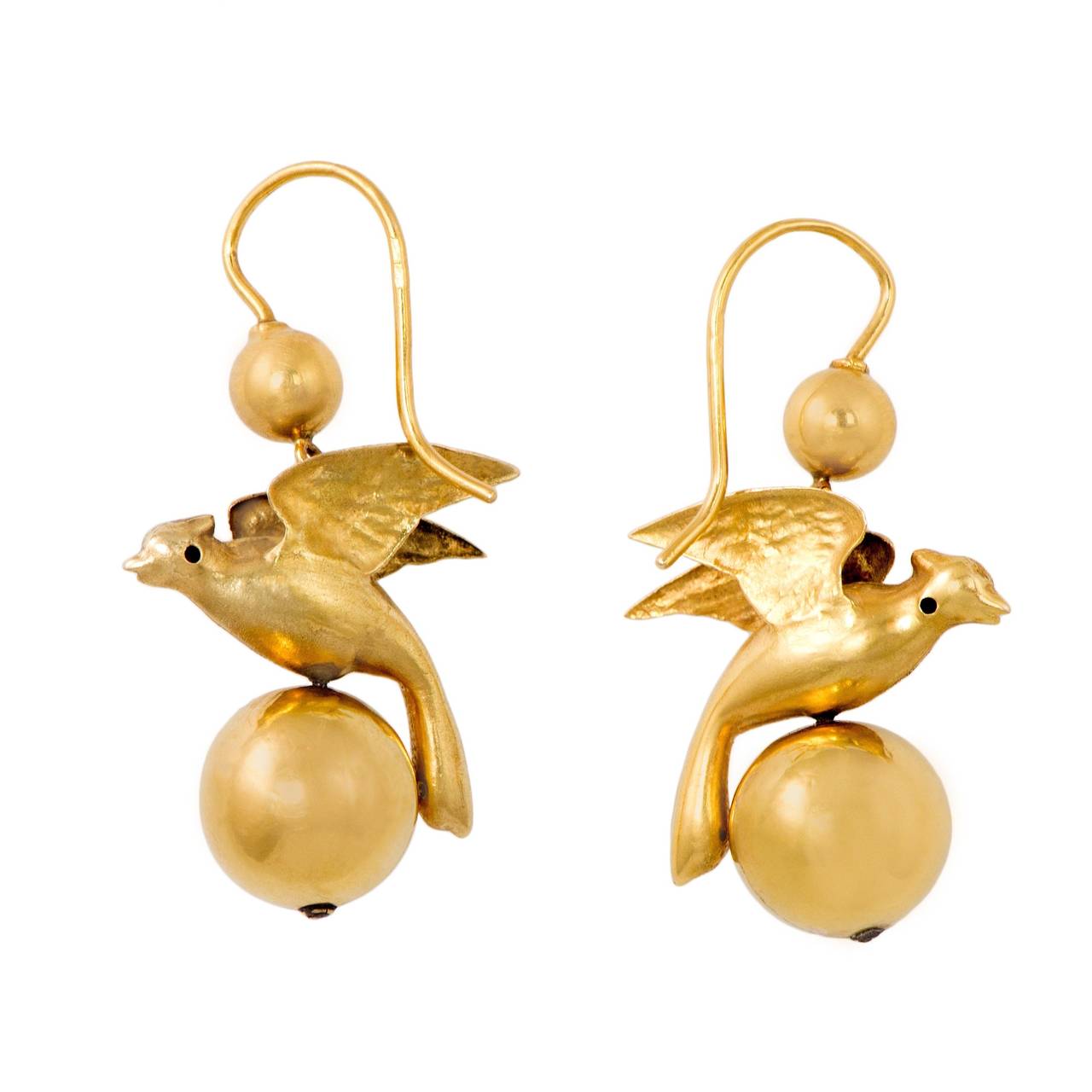 These love bird earrings capture the best of the Victorian era, combining the beauty of the natural world with the symbolism of hope. Bounded on each side by 18k gold orbs, these delicate ornamental earrings are the perfect pair for day and light