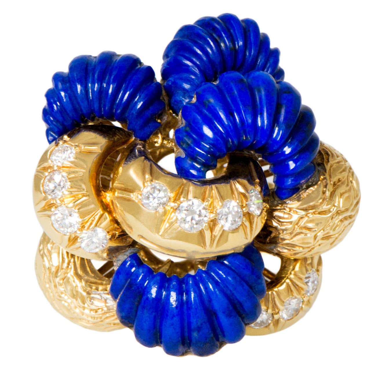 A ravishing scalloped lapis lazuli, diamond and 18 karat gold ring, c. 1960.
Set with approx. 1.10 carats of round brilliant cut diamonds. Stamped 18k. 
Ring size 5.5. This ring can be sized. 
