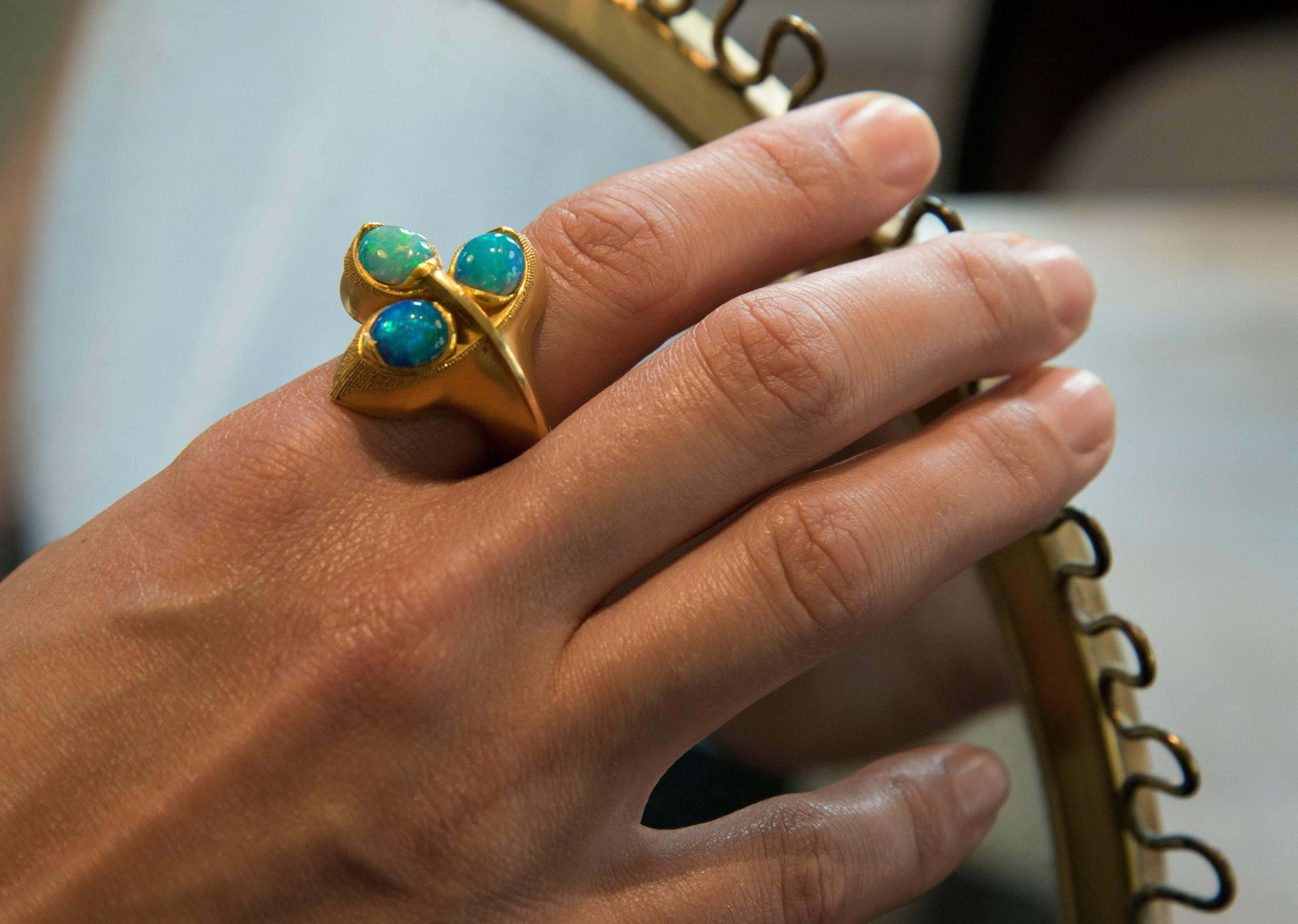 An opal and granulated ring, by a prominent workshop of German jewelers, c. 1960s. The ring is approximately a size 10 and sits beautifully on the middle finger.