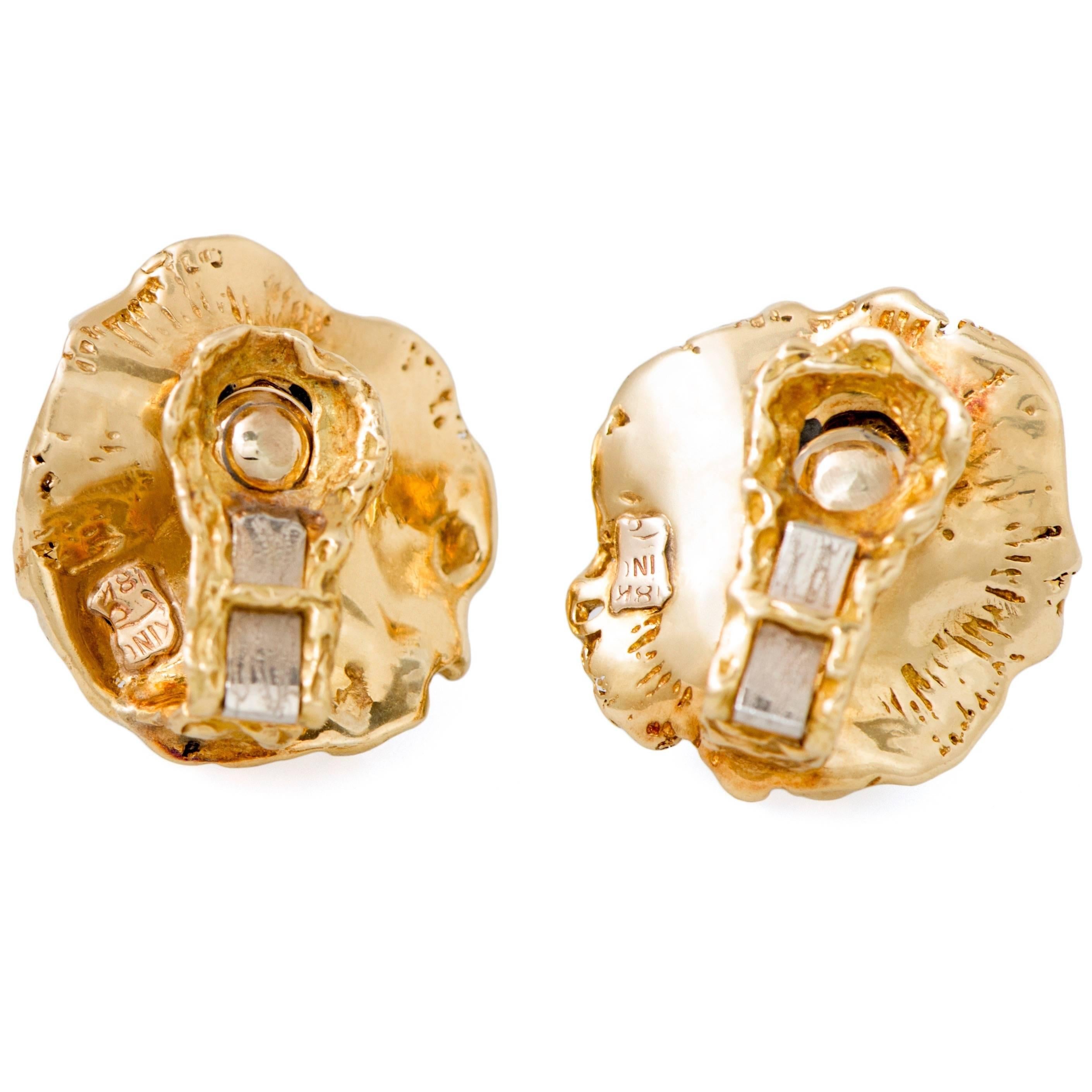 This pair of Arthur King 18k organic style, textured gold, jade, and full cut diamond, clip-on earrings, epitomizes the free-form and lost wax casting movement in American jewelery of the 1970s. Stunning and very comfortable in the ear. Signed.
