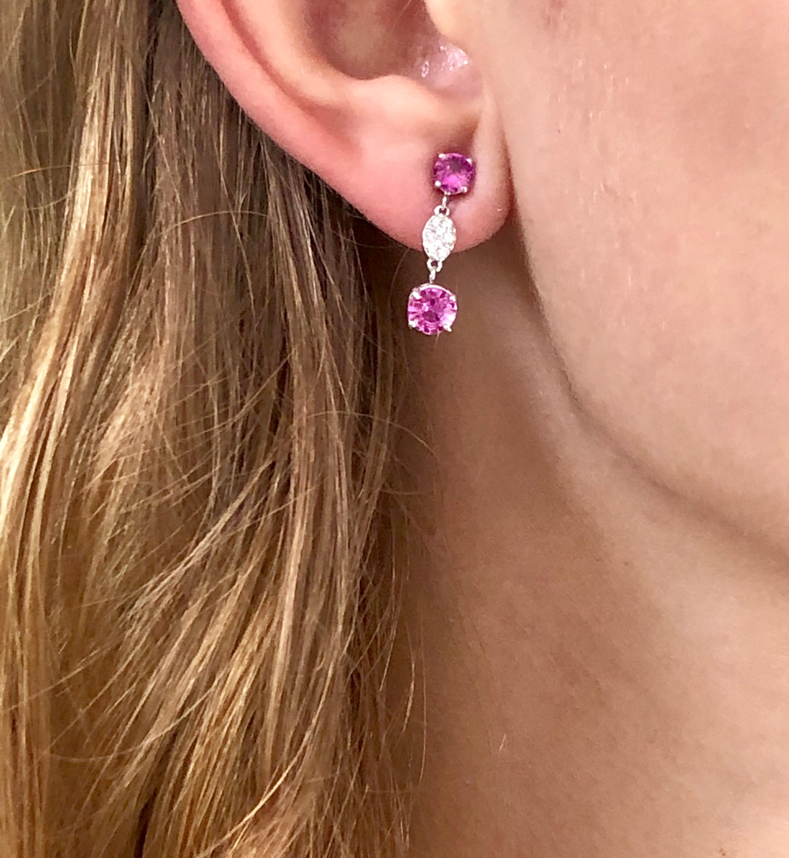 Fourteen karat white gold diamond and pink sapphire earrings one inch long
Four pink Sapphire Weighing 2.10 carats 
Four pink sapphires matching with intense vivid pink color and flawless 
Diamonds weighing 0.22 carat
New Earrings
The 14 karat gold