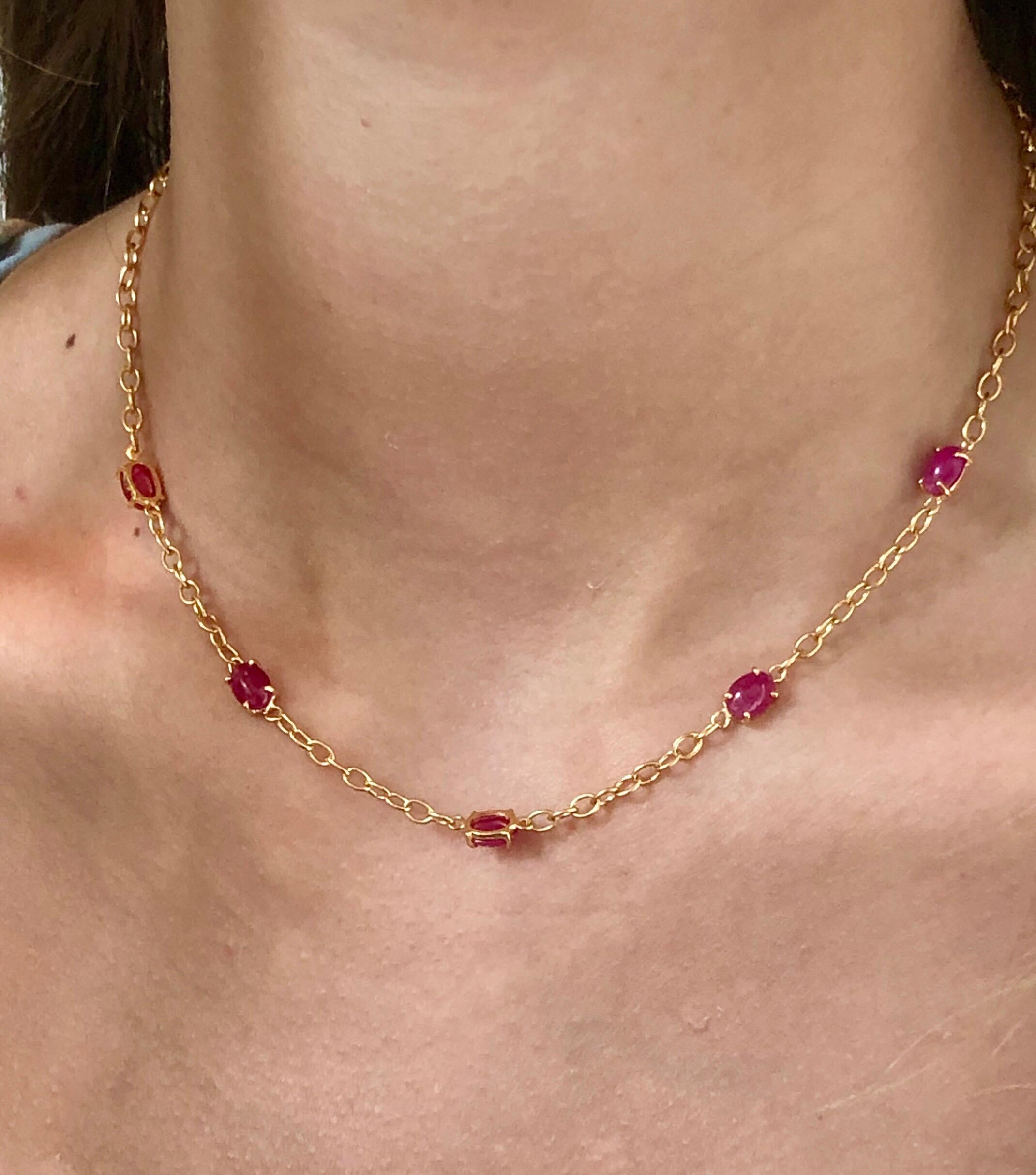 Eighteen karat yellow gold five cabochon ruby necklace pendant 
One tiny diamond on lobster lock weighing 0.03 carat 
Necklace measuring 16 inch long
Five cabochon rubies weighing 7.80 carat
Cabochon rubies are vivid red and perfectly matched
Each