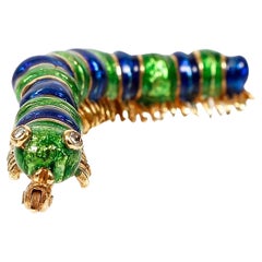 Eighteen Karat Yellow Gold Enamel Caterpillar Brooch with Diamond Eyes