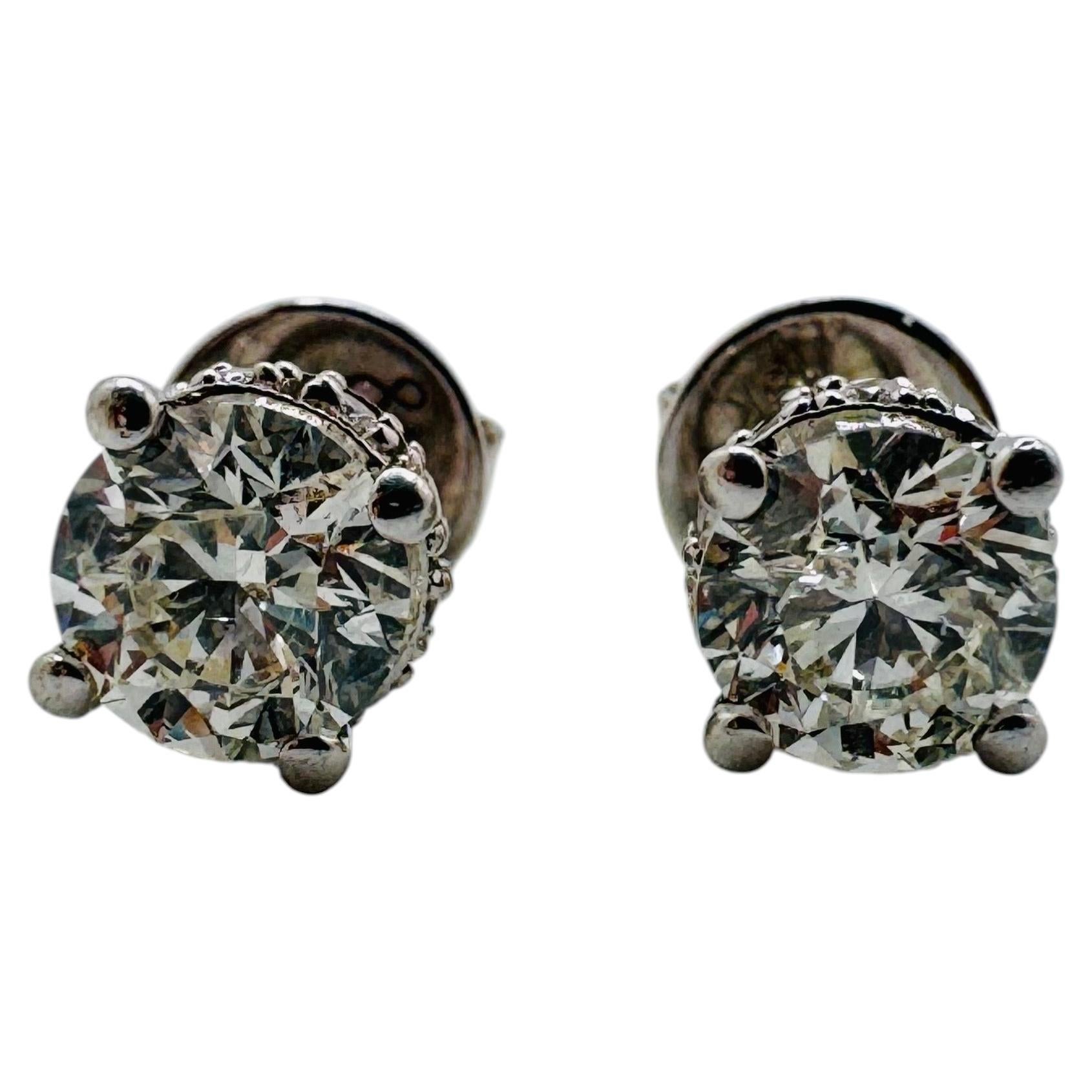 18 Karat White Gold Round Brilliant Diamond Halo Stud Earrings (1.06ctw) For Sale