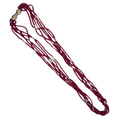 Collana di corallo con perline intrecciate