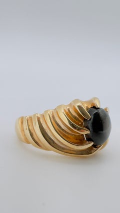 14 Karat Yellow Gold Scallop Swirl Design, Black Oval Cabochon Star Sapphire