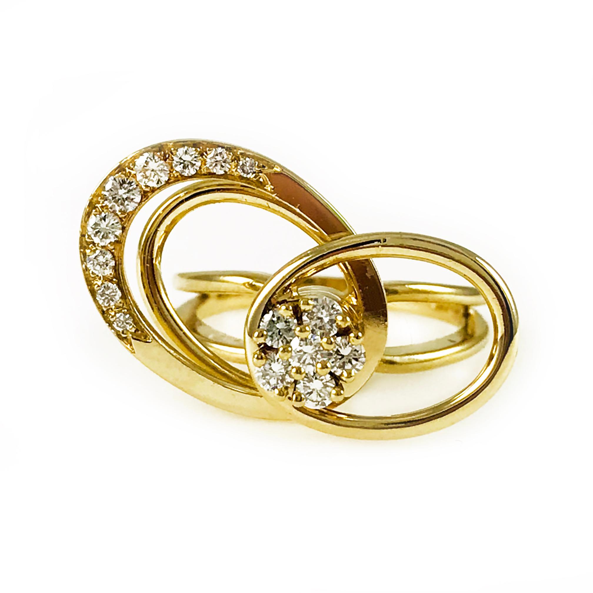 Vintage Norman Teufel 14k Gold Original Swinger Ring®. This multi-tier, three oval motion ring contains six round diamonds in the center in the shape of a flower with the middle and largest oval containing nine graduate diamonds. Engraved on the