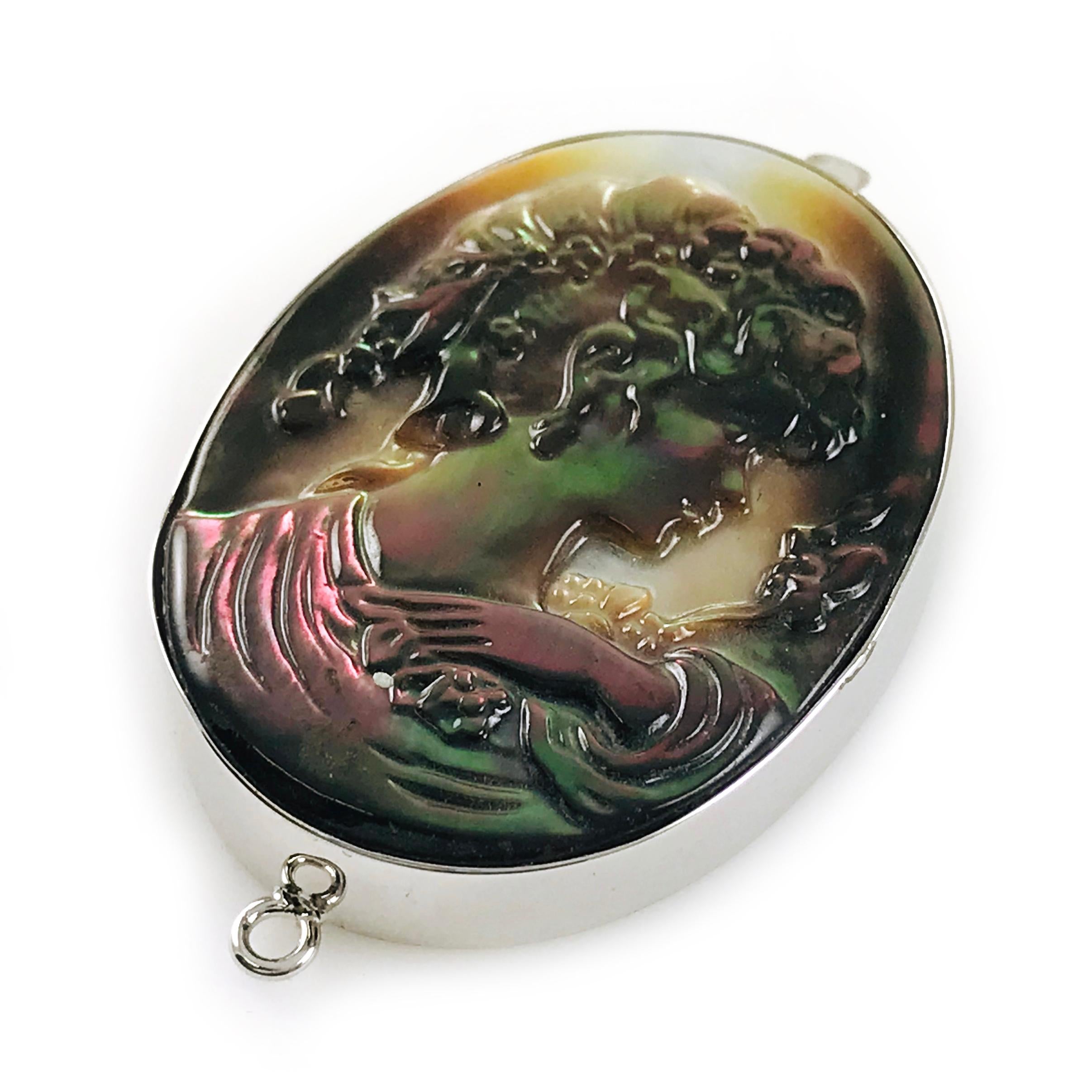 Sterling Silver Black Mother-of-Pearl Cameo Brooch Pendant. Portrait of a lady in profile. Beautifully carved by an artisan in Italy. The size of brooch pendant is approximately 1” x 2”. Could be worn as a brooch or a pendant on a chain. The brooch