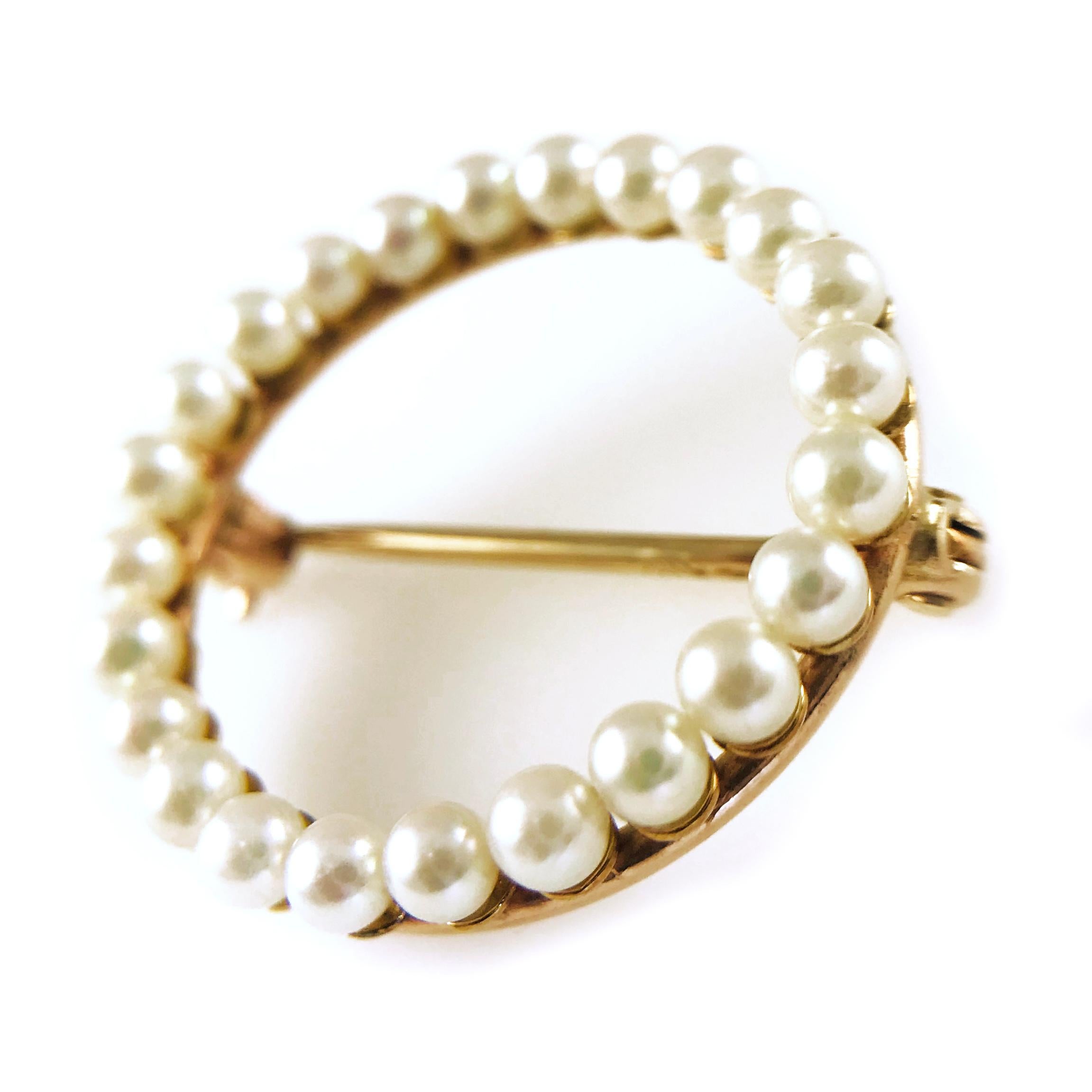 Victorian 14 Karat Yellow Gold Ring of Pearls Pin. Delicate and dainty 3mm pearls set in a circle for a simple yet elegant design. The size of pin pendant is approximately 24mm in diameter. Stamped on the pin is 14K.