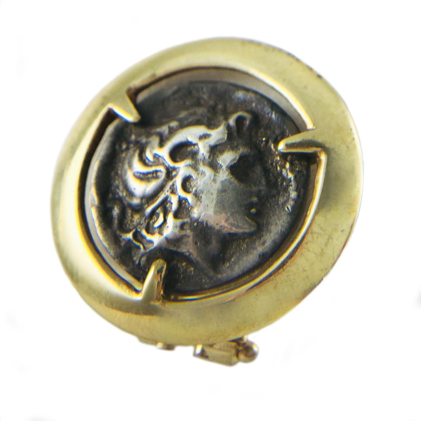 Two-Tone Alexander the Great Coin Stud Earrings. Round 14k Gold mounting with antique silver coin clip-on earrings with post and Omega back. The front of the coin  shows the head of Alexander the Great wearing the horn of Ammon. On the reverse is