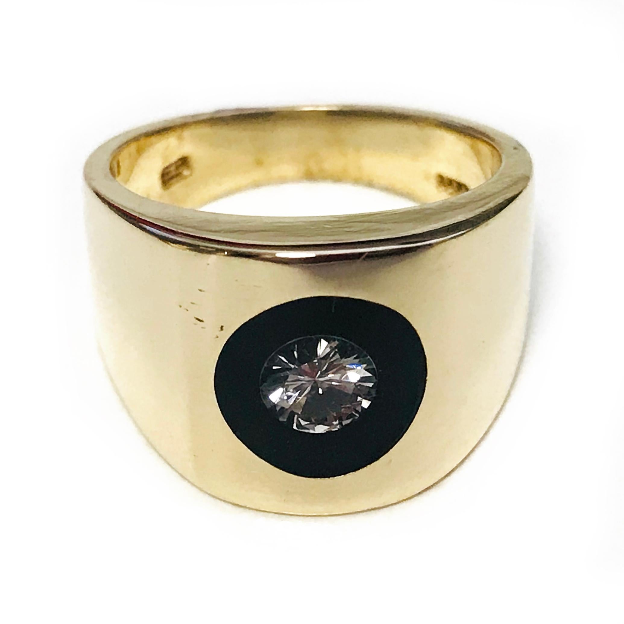 The Incogem Floating Diamond Lucite Ring. Handcrafted 14k Yellow Gold Ring, Floating Diamond in Lucite, 0.35ct round Brilliant-Cut, VS1 in clarity (G.I.A.) and G in color (G.I.A.). This ring size is 6.75. The ring measures approximately 23.1 x