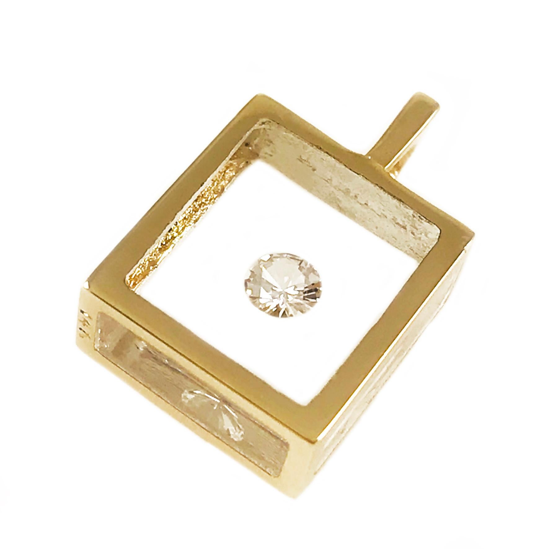 Incogem Floating Solitaire Diamond Pendant: 14k Yellow Gold. The pendants are handcrafted of recycled 14k yellow gold. The diamond is brilliant cut, 58 facets, VS1 in clarity (G.I.A.) and H in color (G.I.A.). The diamond weighs 0.13 carat. The