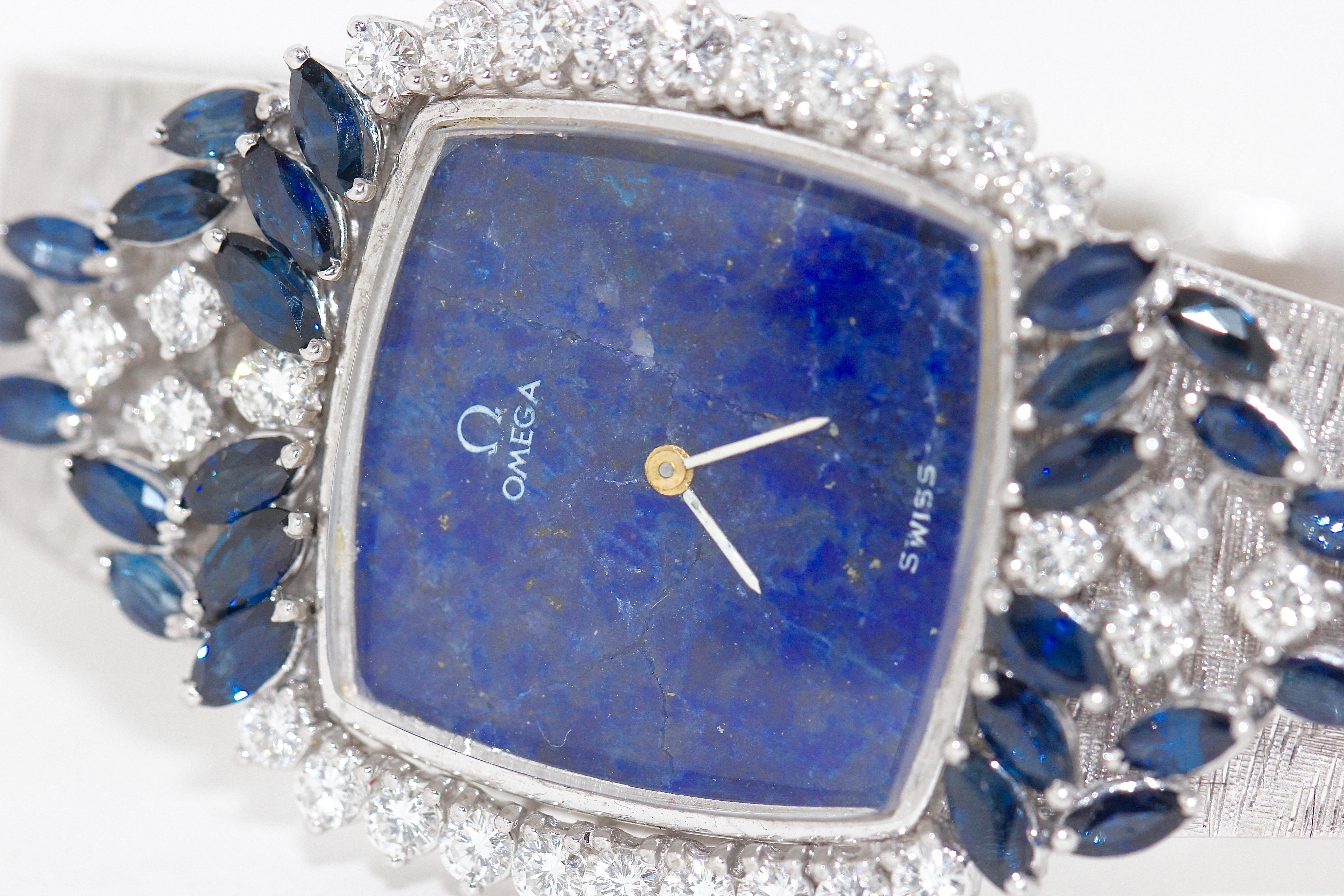 Beautiful and magnificent ladies watch from Omega. 18ct white gold set with brilliants and sapphires of top quality.
Mechanical hand-winding movement.

Unfortunately, the lapis lazuli dial is cracked. The cracks are only visible in the immediate