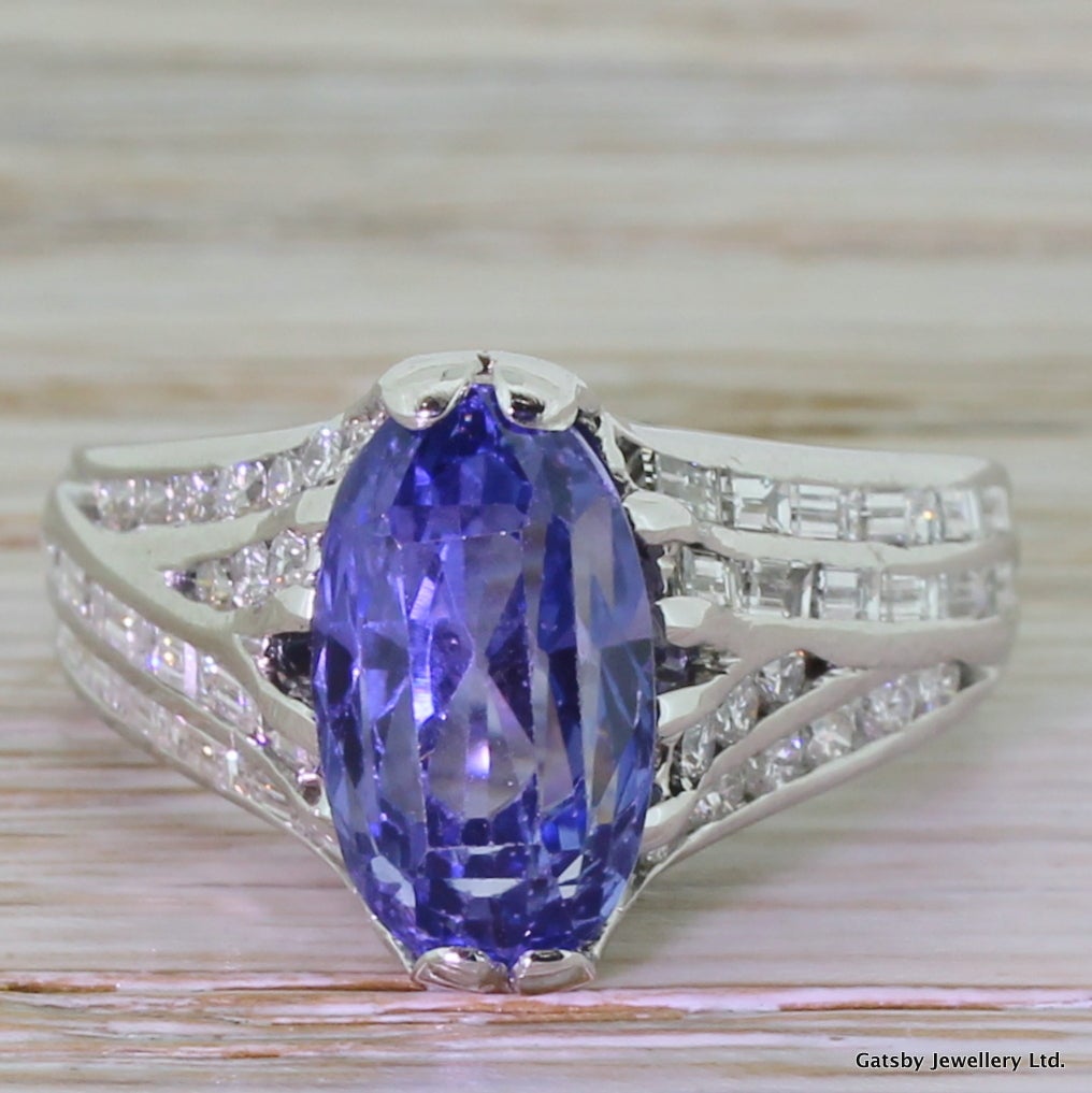 Spectacular. The natural, unheated Ceylon carat oval cut sapphire is mounted in the most beautiful of settings. The stunning and unique handmade mount holds twenty round brilliant cut diamonds and twenty-four baguette cuts in a criss-crossing