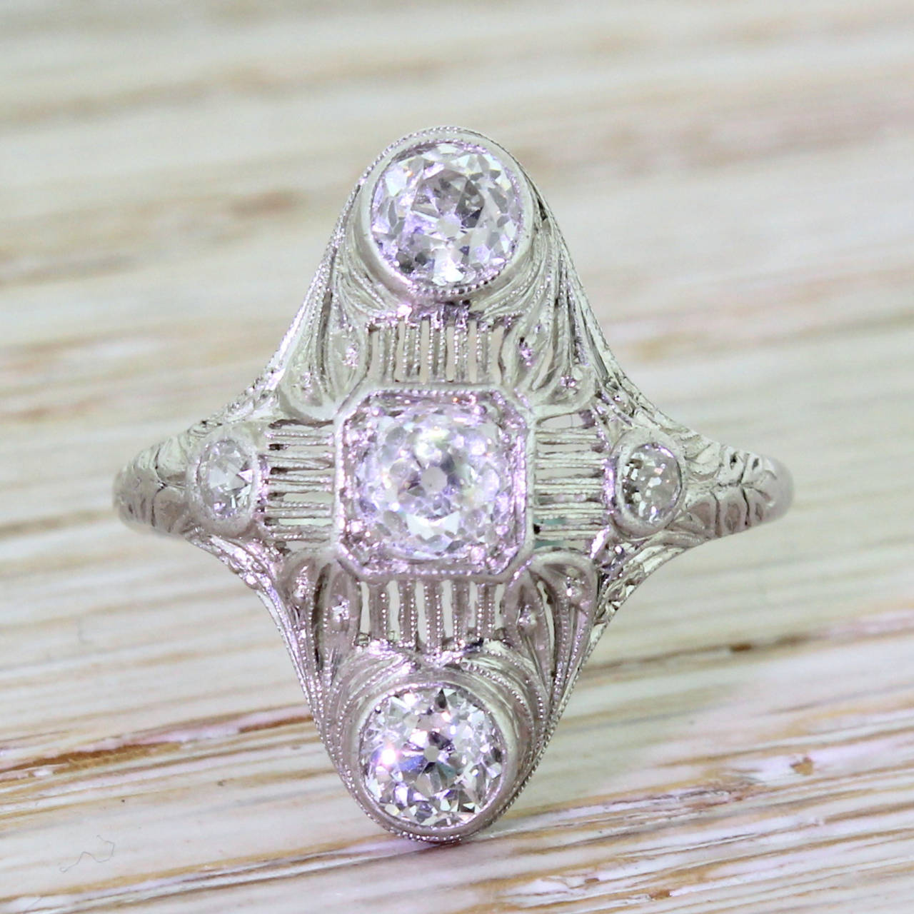 An irreplaceable wonder of a ring from one of the most important American jewellery maker’s of the early part of the 20th century. Five top grade diamonds are set within a geometrical formation that features some of the most intricate piercing and