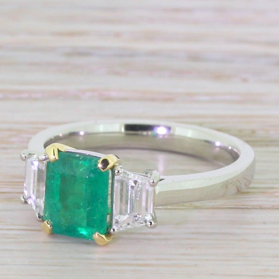Women's Emerald and Trapeze Cut Diamond Platinum Trilogy Ring