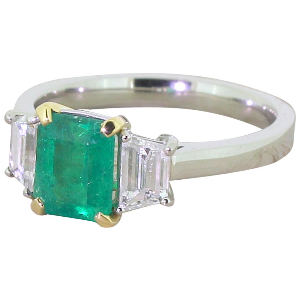 Emerald and Trapeze Cut Diamond Platinum Trilogy Ring