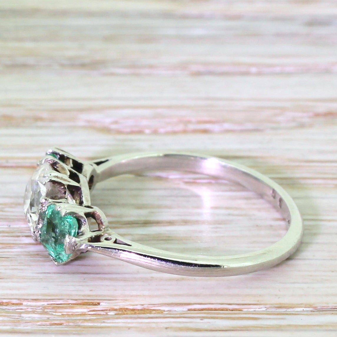 Art Deco Old Cushion Cut Diamond and Step Cut Emerald Trilogy Platinum Ring In Excellent Condition In Theydon Bois, Essex