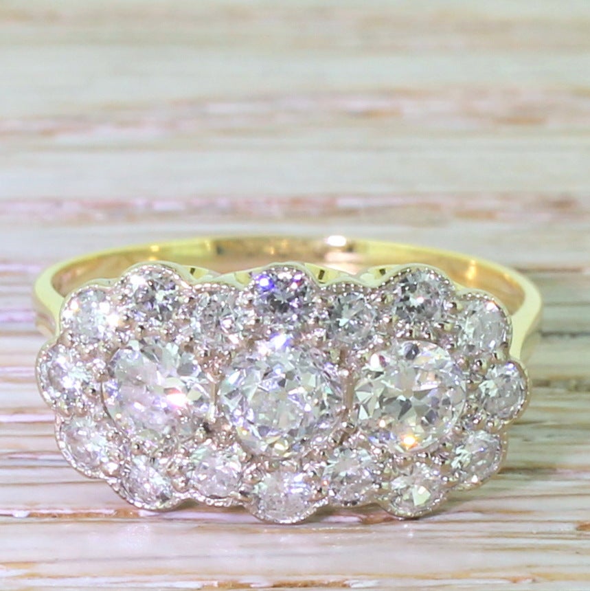 Mid 20th Century 2.07 Carat Old Cut Diamond Triple Daisy Cluster Ring