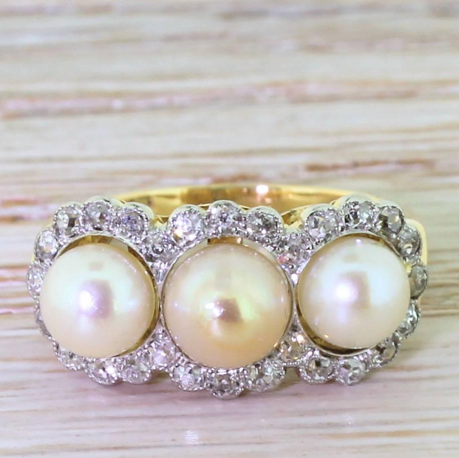 This is the just the sort of the ring that made us fall in love with antique jewellery: beautifully designed, beautifully made with beautiful stones, and rare. The three natural pearls (all slightly different colours through age) “float” within a