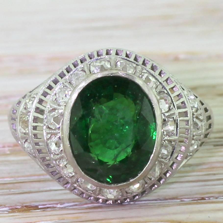 We discovered this wonderful Art Deco mount bereft of a centre stone. After much deliberation, we plumped for gemstone we adore but – as antique dealers – almost never see: tsavorite, first discover in the late 1960s. The stone is rubover set in