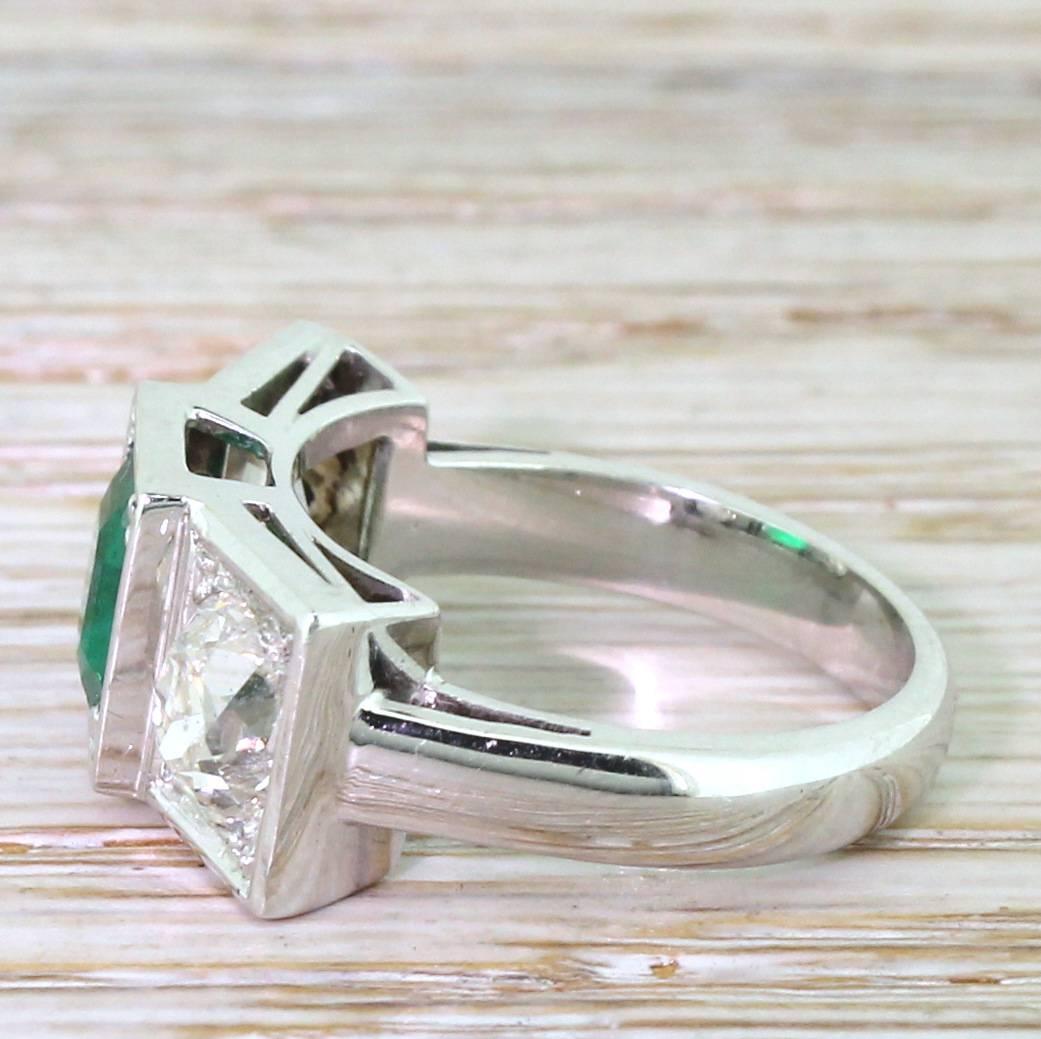 Retro 1.50 Carat Emerald and 2.50 Carat Old Cut Diamond Trilogy Ring In Excellent Condition In Theydon Bois, Essex