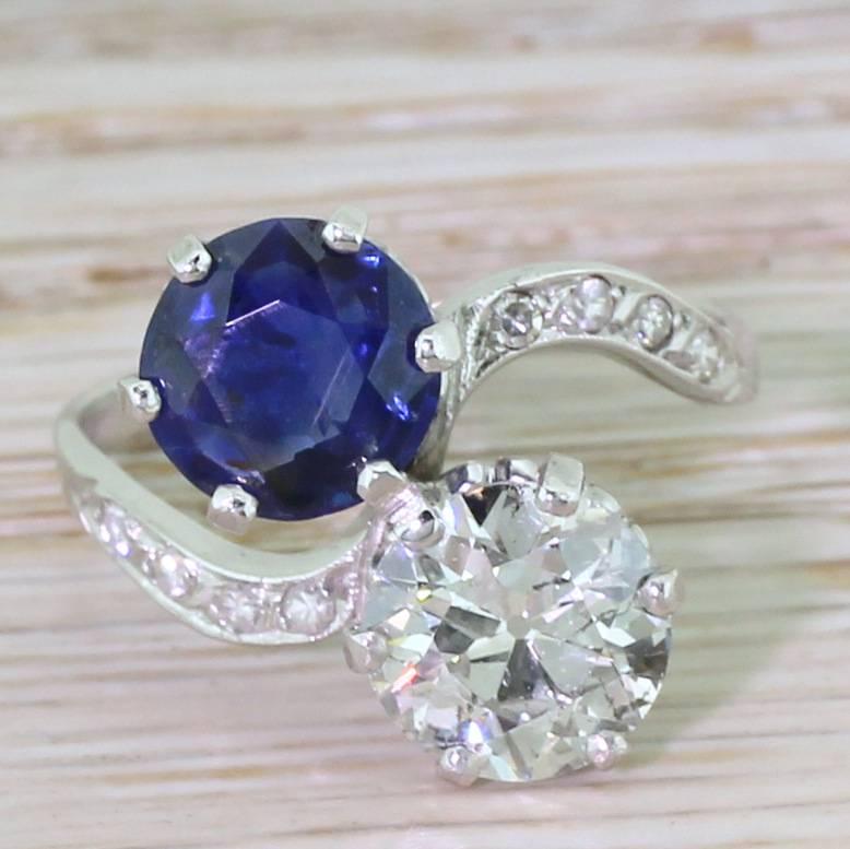 It’s something of an honour to feature this treasure in our collection. The natural (no heat, no treatment) sapphire is a glowing royal blue with flashes of indigo. This stone sits across from a blindingly white high old European cut diamond which