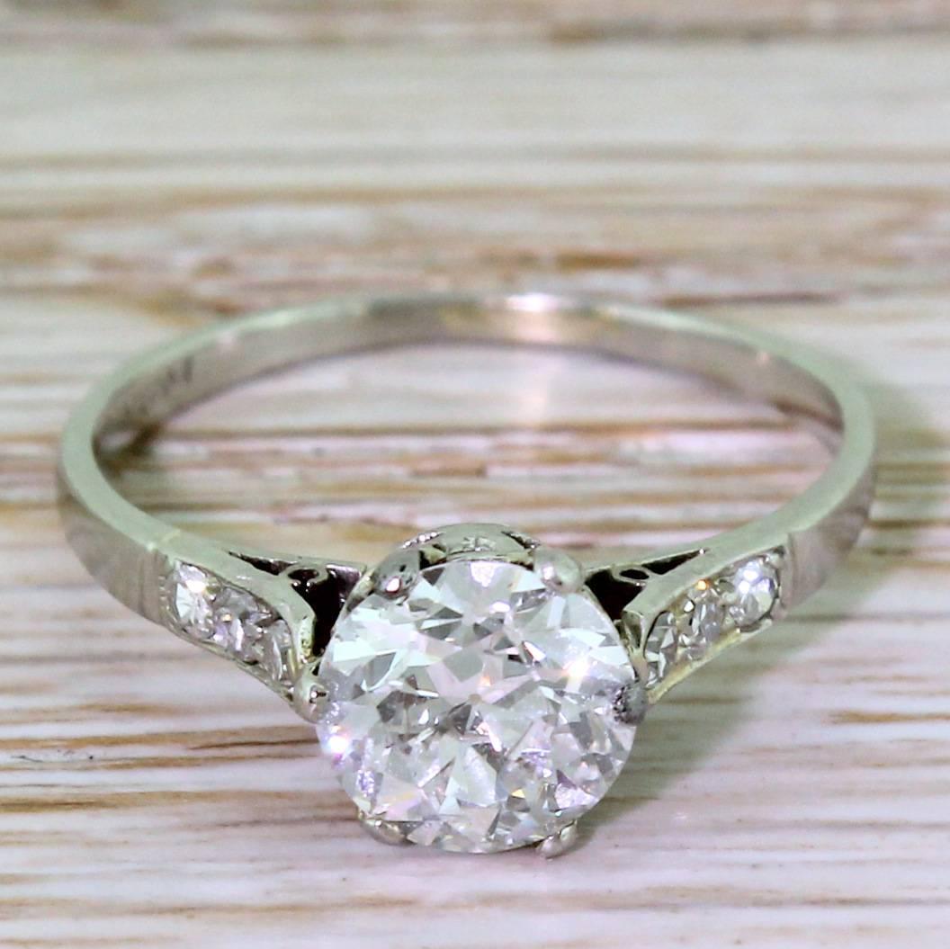 An awesome diamond set in a beautiful and sympathetic mount. The old European cut diamond is high white, internally clean and absolutely bursting with fire and brilliance. Secured in a six claw collet with neat heart detailing in the gallery,