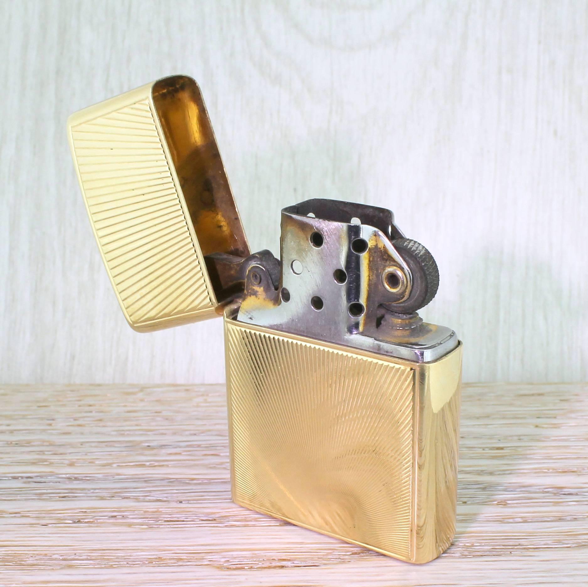 Incredibly cool and very, very rare. The Cartier Zippo lighter case is in solid 14k yellow gold with incised rays emanating from the bottom centre of the case.

Weighs, without the internal Zippo mechanism, 38.5 grams.