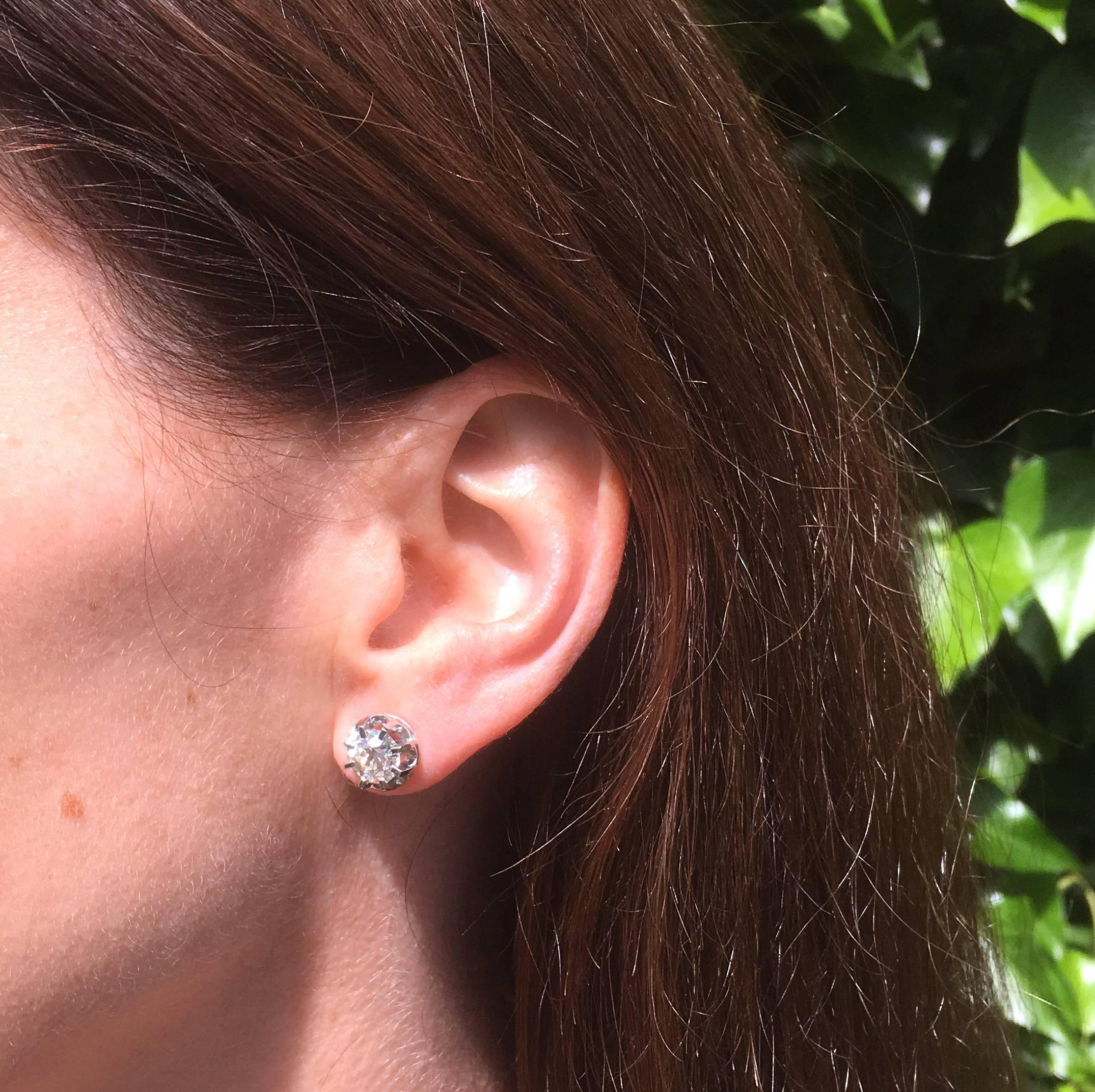 An exquisite pair of old cut diamond stud earrings. The stones – both high white, internally clean and impressively vibrant – are secured in eight-claw scalloped-back settings. Open galleries on each stud allows maximum light to pass through the