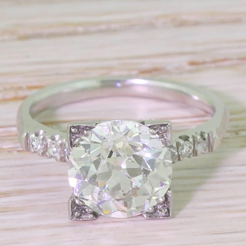 In a word: awesome.  The crazily bright and internally clean old European cut diamond is bright, internally very clean and almost alive with fire and brilliance. This high class stone is showcased in an equally impressive mounting; the four square