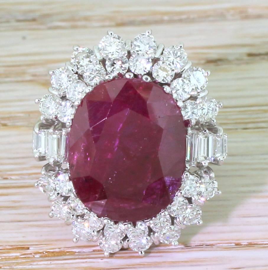 Magnificent. The natural, unheated ruby is the a glowing, rich pigeon blood red and is showcased in the most impressive of rings. With thirty-two brilliant cut and six baguette cut diamonds – all high white, internally clean and incredibly bright –