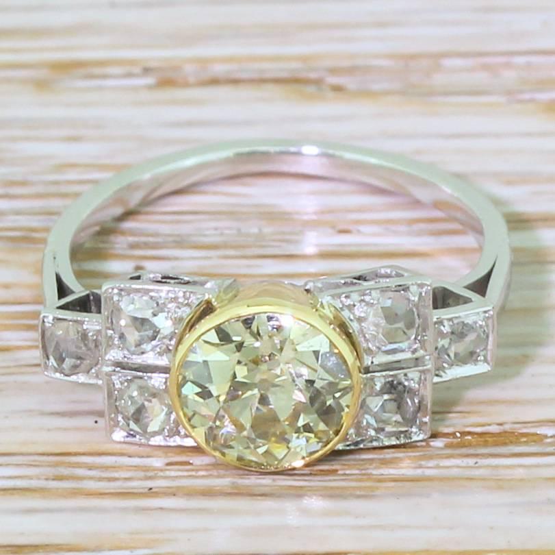 So, so beautiful. The old cut diamond in the centre displays a bright, golden hue; the colour of which is emphasised by the yellow gold rubover setting. Six (three either side) rose cut diamond are set in the box-shaped shoulders, leading to a slim