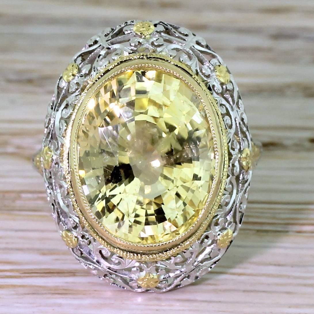 The most awesome ring. The vivid canary yellow Ceylon sapphire – natural and with no indications of heating or treatment – is showcased in the most breathtaking of mount. The ornate setting is intricately pierced and etched, with yellow gold flower