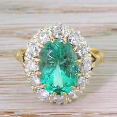 Midcentury 3.26 Carat Colombian Emerald and Diamond Cluster Ring, circa 1950