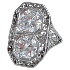 Art Deco Old Mine Cut Diamond Toi-Et-Moi Ring In Platinum.