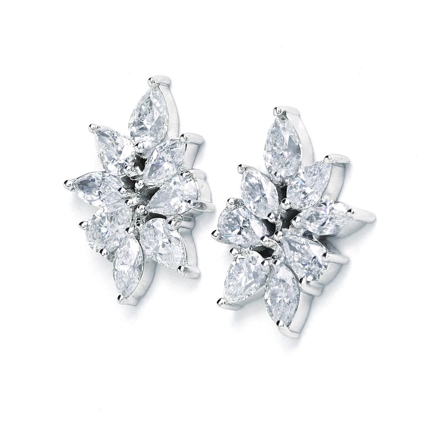 These New York Jewelers earrings are made of 14K white gold. It contains pear G-H color, SI clarity diamonds weighing 5.39 CTTW, marquise G-H color and SI clarity diamonds weighing 2.40 CTTW.