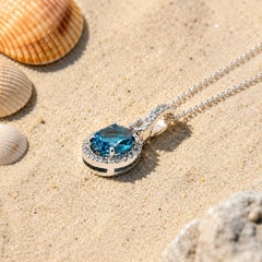Georgios Collection 18 Karat White Gold Oval Blue Topaz and Diamond Halo Pendant